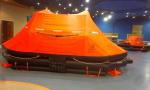 Self righting inflatable life raft for marine water saving