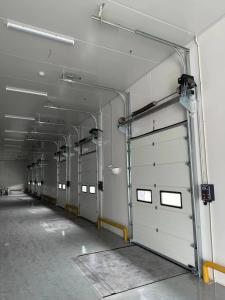 China Overhead sectional door is one of most widely used among in industrial doors at present wholesale