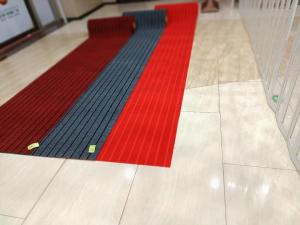China Hotel Door Polyester Area Rugs Red Colour Washable on sale