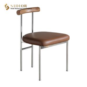 China Nordic Industrial Style Black Pu Leather Dining Chairs With Solid Wood Backrest wholesale