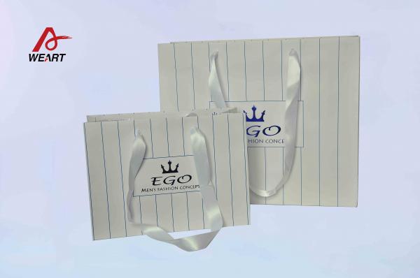 Quality White Silk Ribbon Cute Paper Bags Hot Stamping Finish CMYK Surface Embossed Logo for sale