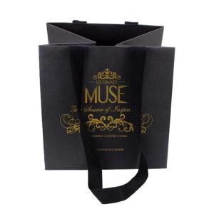 China Matt Black Kraft Paper Gift Bags Clothing Packaging Bags With Handles And String wholesale