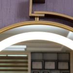 Transform Your Bathroom with Golden Framed LED Lighted Round Wall Mirror