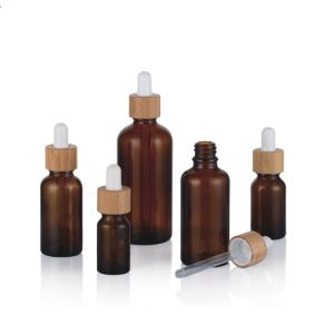 China 1oz Empty Amber Black Essential Oil Glass Dropper Bottles With Bamboo Lids wholesale