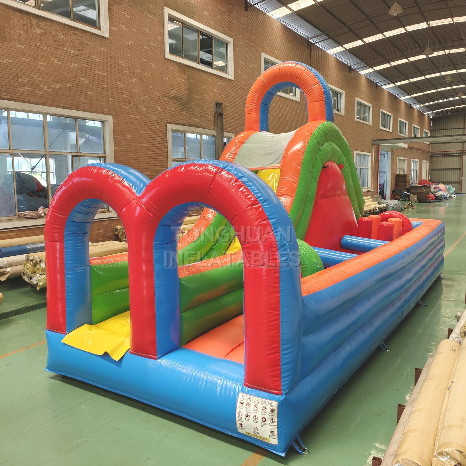 Colorful Compact Inflatable Obstacle Course with Entrance Arches Climbing Slide and Safety Mesh for Schools Events and Rental Business