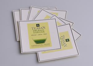 China Personalized printed silver embossing self adhesive artpaper labels for green tea packaging wholesale