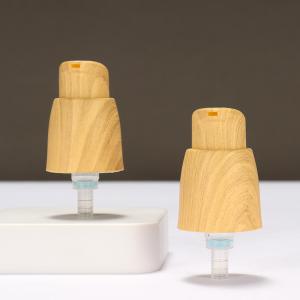 China Outer Spring Airless 0.25cc Plastic Lotion Pump Hand Lotion Pump With Wood Grain wholesale