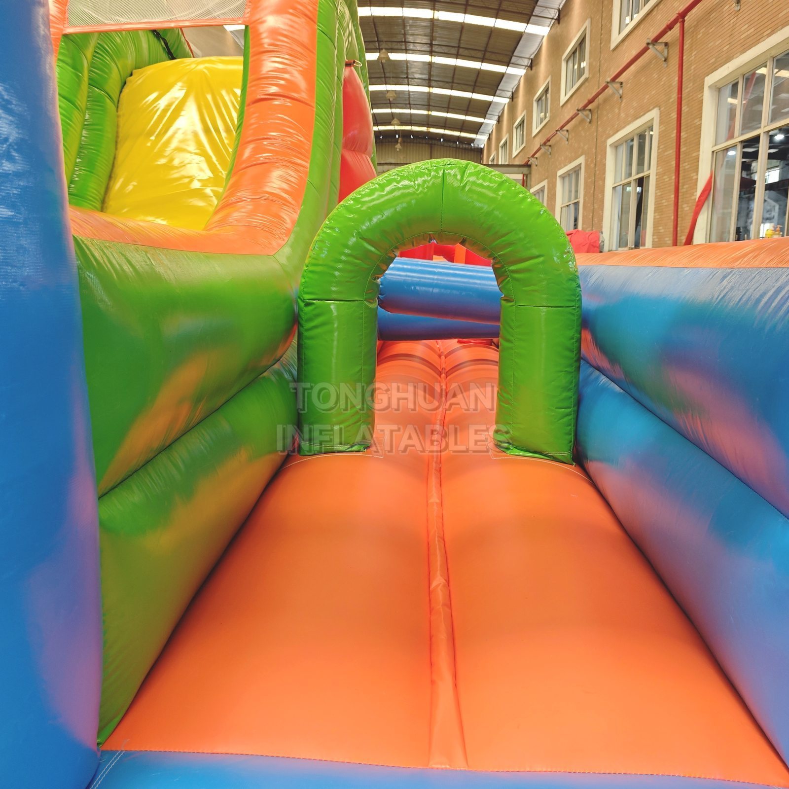 Colorful Compact Inflatable Obstacle Course with Entrance Arches Climbing Slide and Safety Mesh for Schools Events and Rental Business