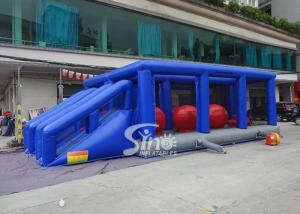 China Outdoor double lane adults interactive inflatable assault course with big bouncing balls wholesale