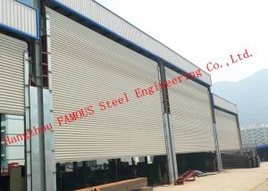 China Frequency Controlled Vertical Lifting Fabric Industrial Doors For Large Openings on sale