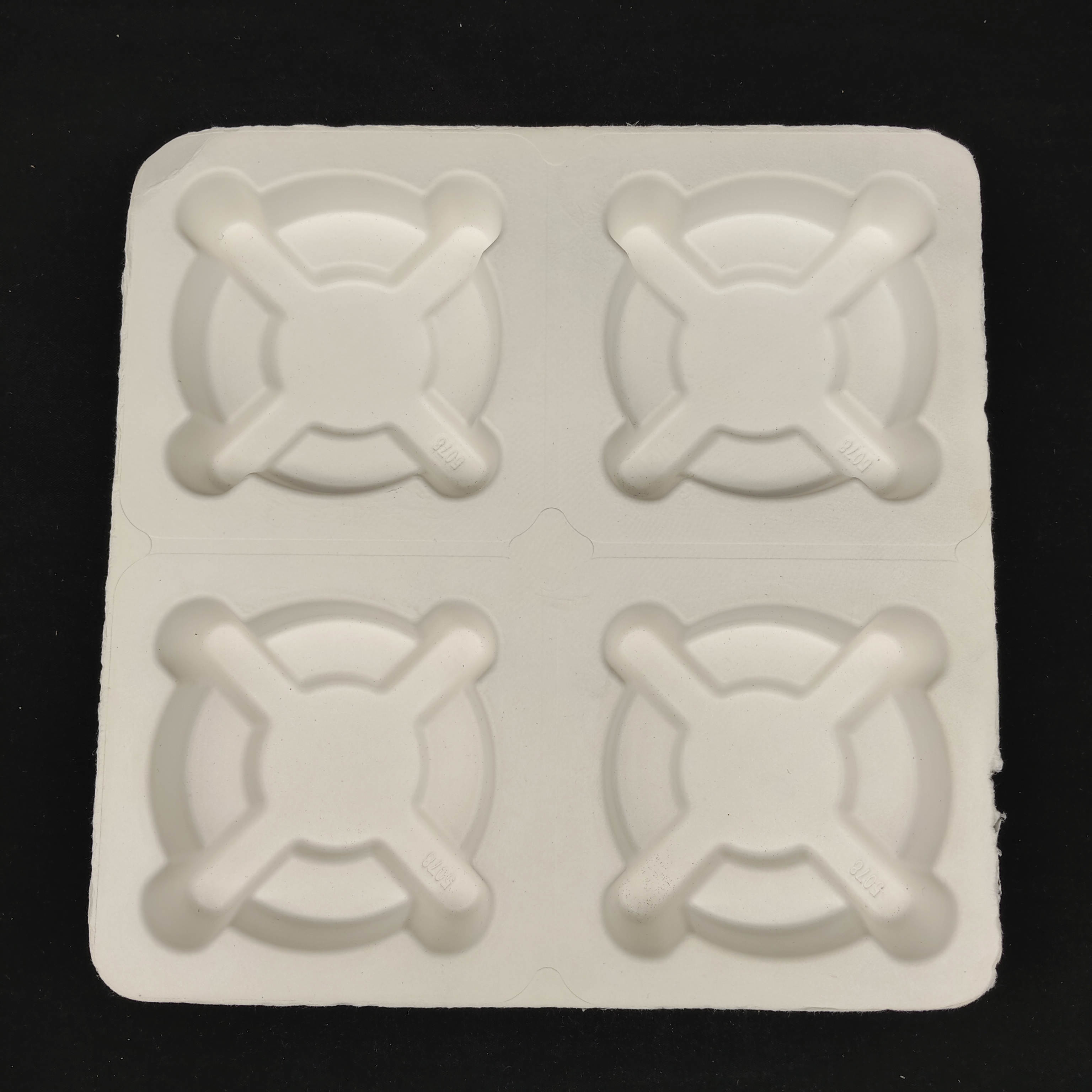 Made in China. The pulp-molded anti-shake base for takeaway coffee is environmentally friendly and biodegradable, and complies with the plastic ban.