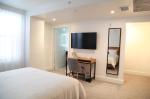 Phu Quoc Island travel vacation hotel guestroom oak wood bed with Nightstand and