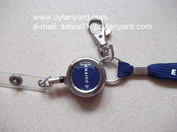 Printed tubular lanyard with metal badge reel and metal sheet crimp,