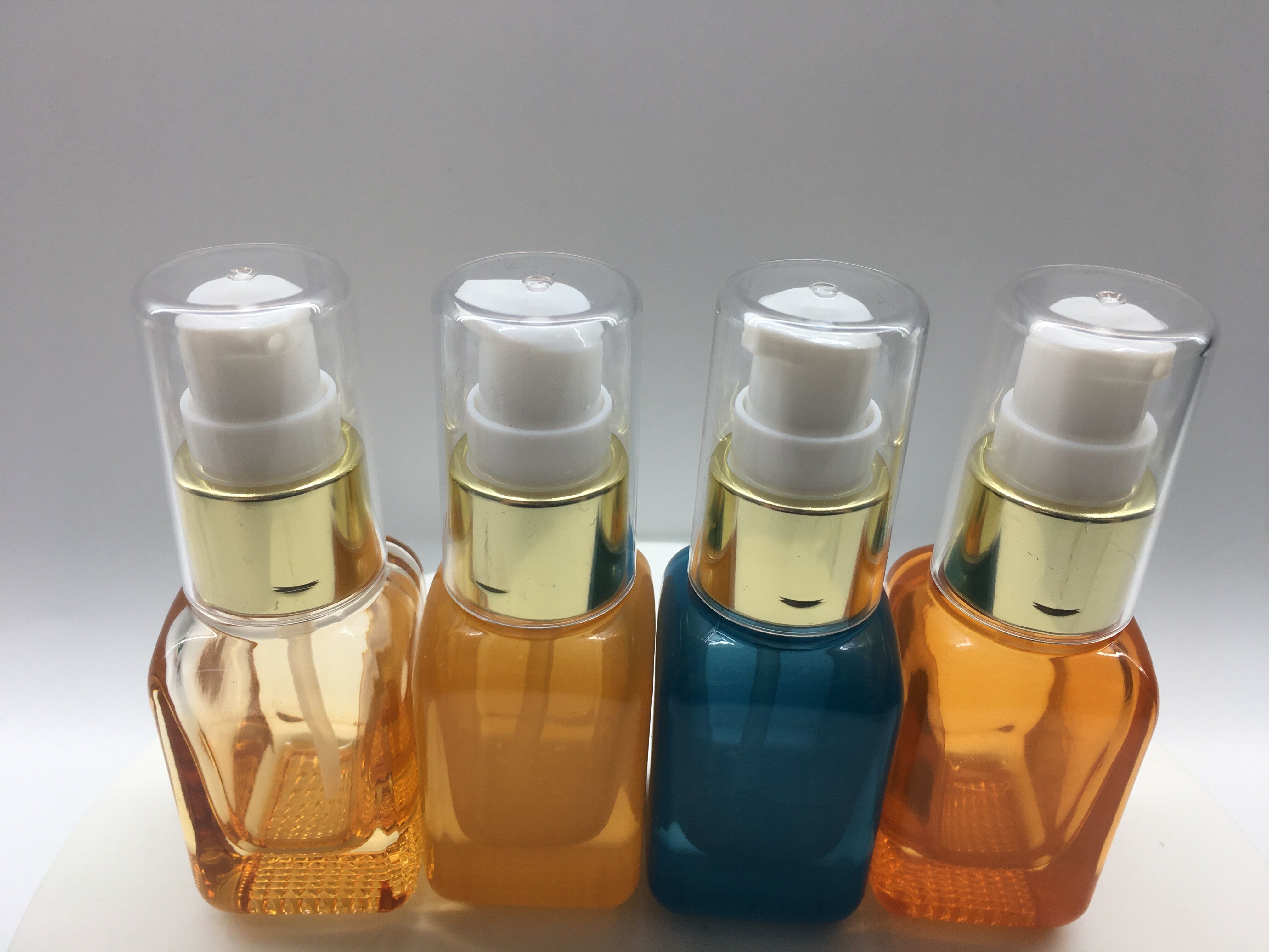 SGS ISO MSDS Orange Blue 20ml Glass Pump Bottle For Lotion And Serum
