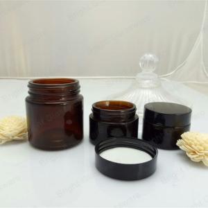 China Face cream amber glass jar with black plastic cap wholesale