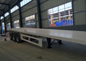 China Flatbed Semi Trailer Truck 3 Axles Container Carrying Heavy Equipment Trailer wholesale