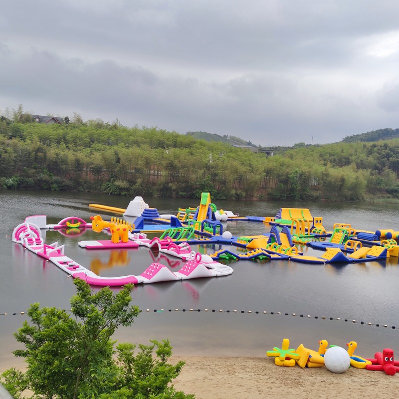 Modular Inflatable Water Park with Custom Floating Obstacle Course Slides Climbing Elements And Connected Play Platforms for Lake Resort Beach And