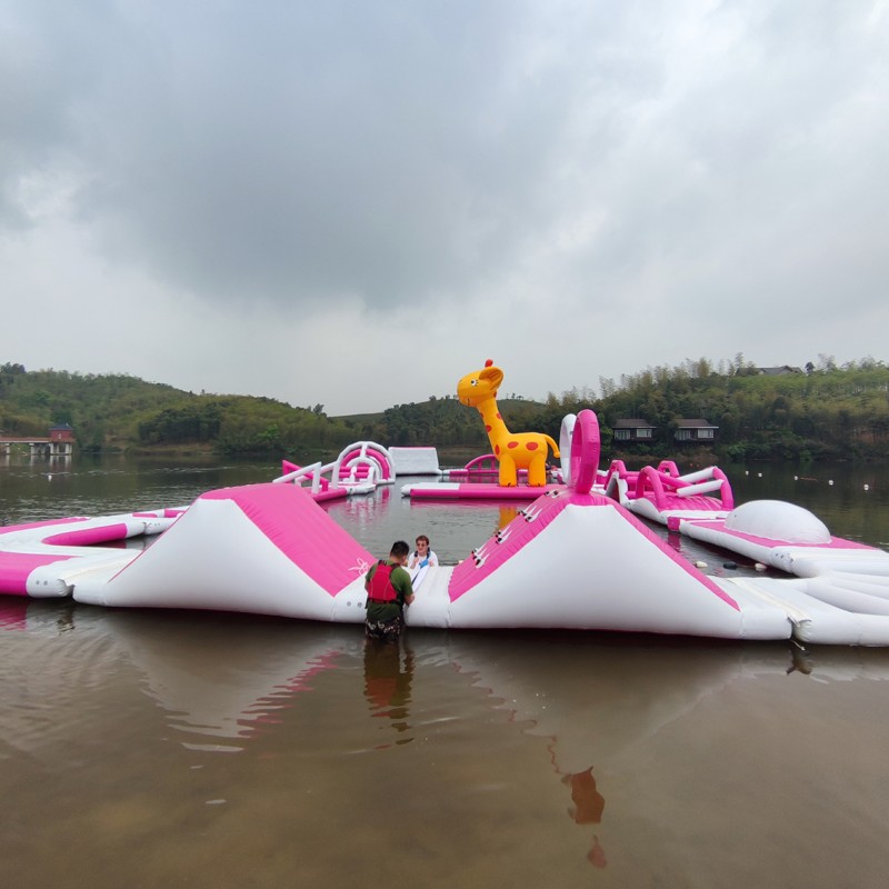 Modular Inflatable Water Park with Custom Floating Obstacle Course Slides Climbing Elements And Connected Play Platforms for Lake Resort Beach And